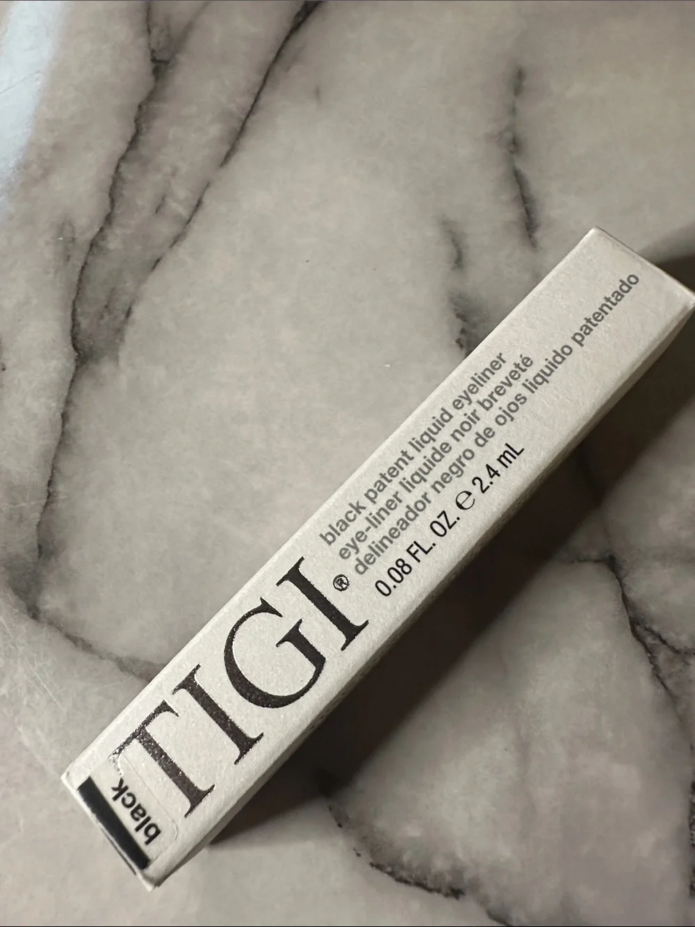 TIGI Compact Pressed Setting Powder color- Entice, black liquid eyeliner